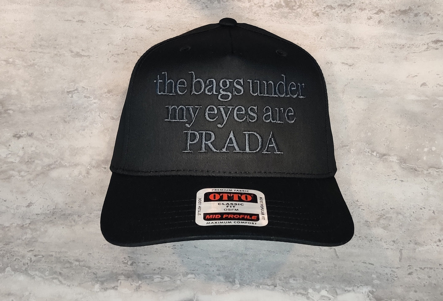 the bags under my eyes are PRADA